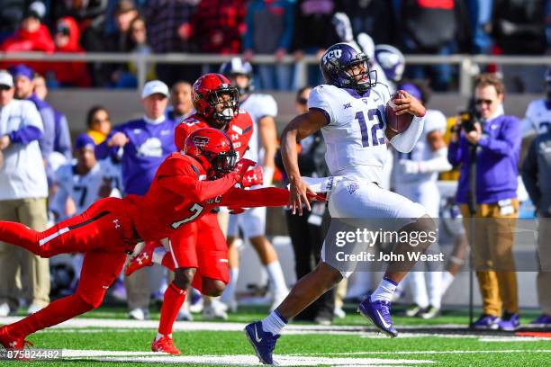 Shawn Robinson of the TCU Horned Frogs outruns Jah'Shawn Johnson of the Texas Tech Red Raiders during the first half of the game on November 18, 2017...