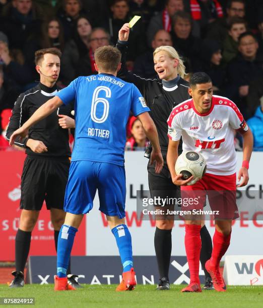 Referee Bibiana Steinhaus displayes Yellow Card for Bjoern Rother of Magdeburg during the 3. Liga match between SC Fortuna Koeln and 1. FC Magdeburg...
