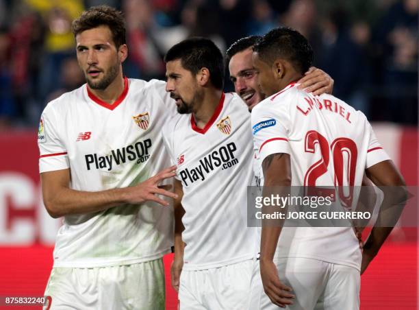 Sevilla's Spanish forward Nolito celebrates a goal with Argentinian midfielder Franco Vazquez , Spanish midfielder Pablo Sarabia and Colombian...