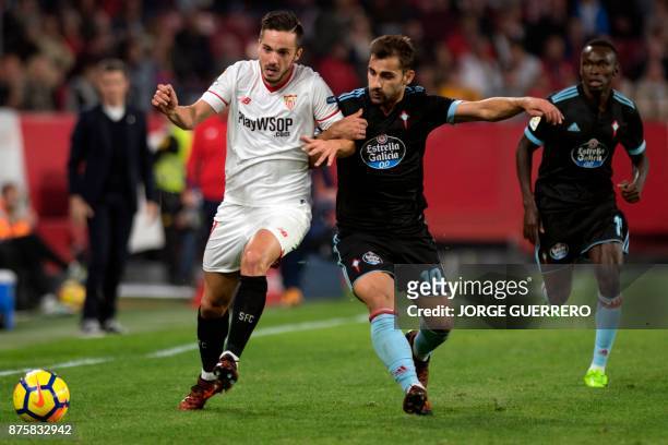 Sevilla's Spanish midfielder Pablo Sarabia vies with Celta Vigo's Spanish defender Jonny Castro during the Spanish league football match Sevilla vs...
