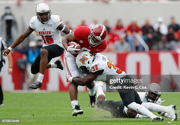 Josh Jacobs of the Alabama Crimson Tide is tackled by Brandon Coney of the Mercer Bears at Bryant-Denny Stadium on November 18, 2017 in Tuscaloosa,...