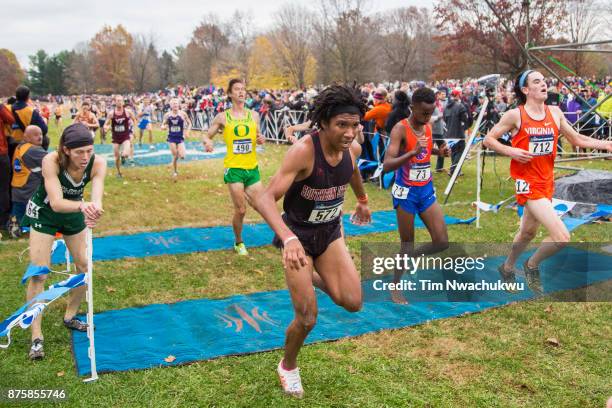 Runners cross the finish line during the Division I Men's Cross Country Championship held at E.P. Tom Sawyer Park on November 18, 2017 in Louisville,...