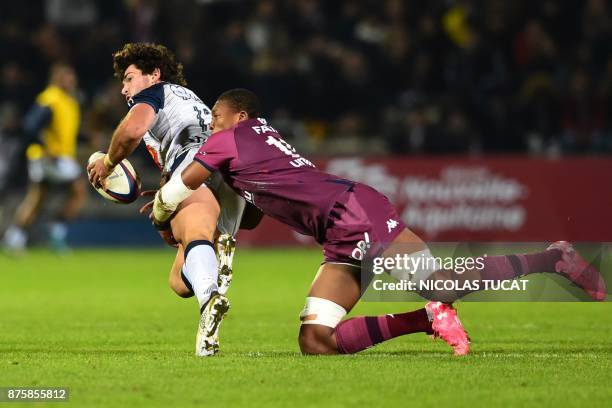 Agen's French centre Pierre Fouyssac is tackled during the French Top 14 rugby union match between Bordeaux-Begles and Agen on November 18, 2017 at...