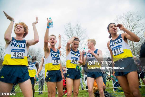 Northern Arizona University runners celebrate after completing the Division I Men's Cross Country Championship held at E.P. Tom Sawyer Park on...