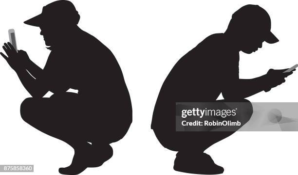 squatting couple looking at their smart phones - sun visor stock illustrations