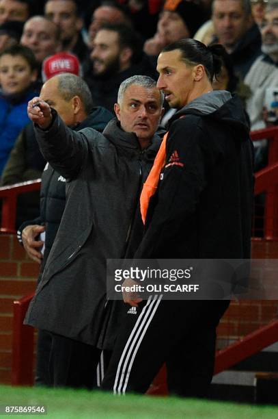 Manchester United's Portuguese manager Jose Mourinho gives instructions to Manchester United's Swedish striker Zlatan Ibrahimovic before Manchester...