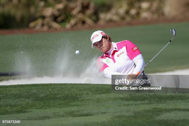 Ariya Jutanugarn of Thailand plays a shot from a bunker on the 17th hole during round three of the CME Group Tour Championship at the Tiburon Golf...