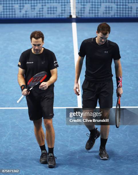 Jamie Murray of Great Britain and Bruno Soares of Brazil show their dejection during their straight sets defeat by Henri Kontinen of Finland and John...