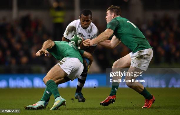 Dublin , Ireland - 18 November 2017; Kini Murimurivalu of Fiji is tackled by Dave Kearney, left, and Chris Farrell of Ireland during the Guinness...