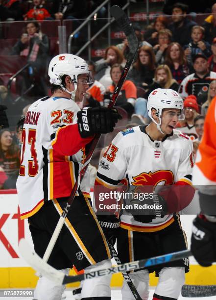 Sean Monahan of the Calgary Flames celebrates his third power-play goal of the second period against the Philadelphia Flyers with Johnny Gaudreau on...