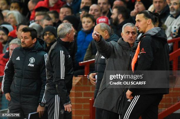 Manchester United's Portuguese manager Jose Mourinho gives instructions to Manchester United's Swedish striker Zlatan Ibrahimovic before Manchester...