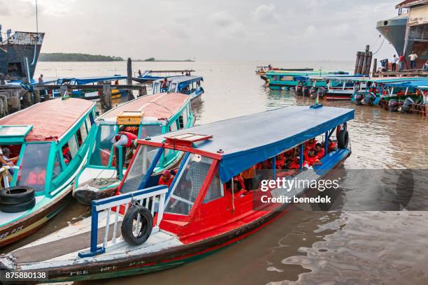 passenger boats with commuters docked in georgetown guyana - guyana stock pictures, royalty-free photos & images
