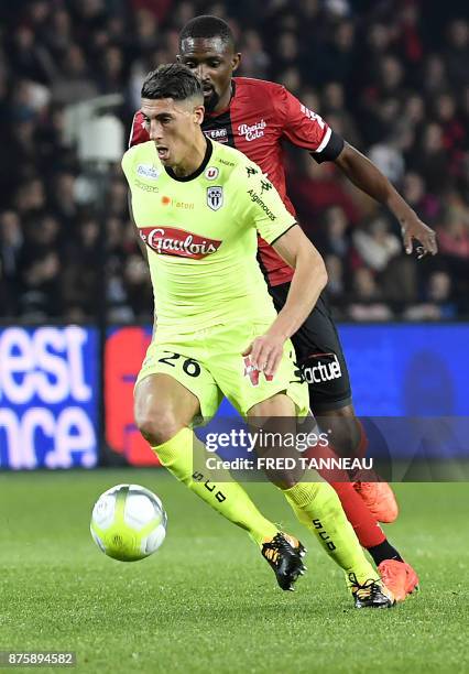 Guingamp's Senegalese midfielder Moustapha Diallo vies with Angers's Algerian defender Mehdi Tahrat during the French L1 football match between...