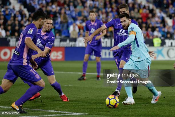 Ezequiel Munoz of Leganes, Lionel Messi of FC Barcelona during the Spanish Primera Division match between Leganes v FC Barcelona at the Estadio...