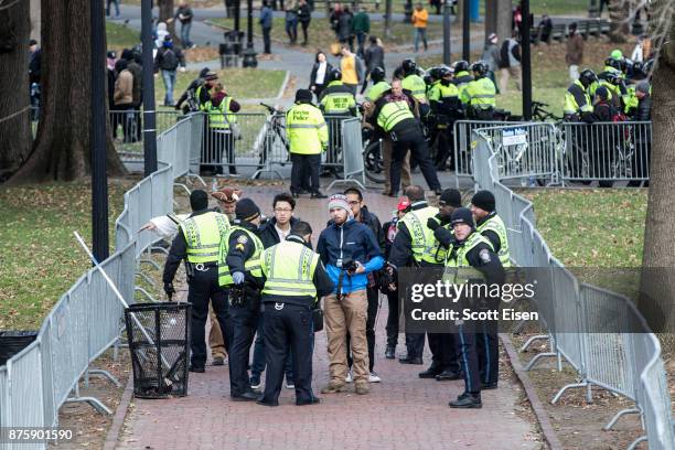 Police search people endering a secured area where an Alt-Right organized free speech event was taking place on the Boston Common on November 18,...