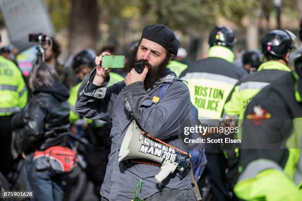 Counter-protester of an Alt-Right organized free speech event talks into a megaphone on the Boston Common on November 18, 2017 in Boston,...