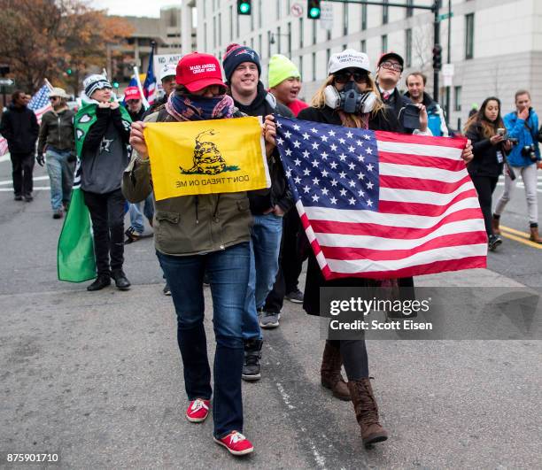 Participants of an Alt-Right organized free speech event march from the Boston Common back to their vehicles on November 18, 2017 in Boston,...