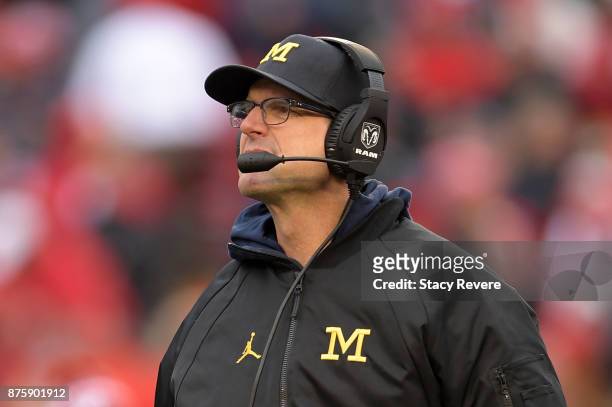 Head coach Jim Harbaugh of the Michigan Wolverines watches action during a game against the Wisconsin Badgers at Camp Randall Stadium on November 18,...