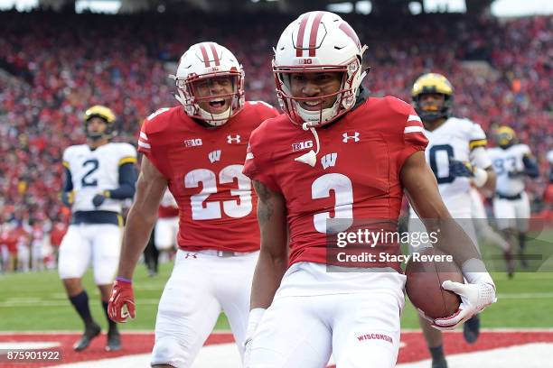 Jonathan Taylor of the Wisconsin Badgers reacts to a touchdown by Kendric Pryor during the third quarter of a game against the Michigan Wolverines at...