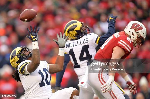 Devin Bush of the Michigan Wolverines intercepts a pass during the third quarter of a game against the Wisconsin Badgers at Camp Randall Stadium on...