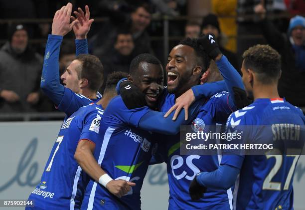 Strasbourg's French forward Stephane Bahoken celebrates withi teammates after scoring a goal during the French L1 football match between Strasbourg...