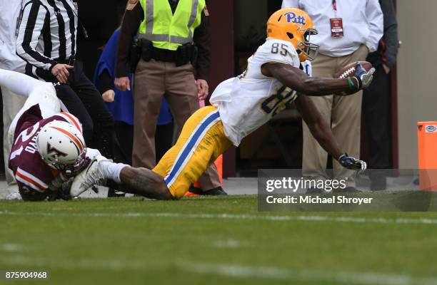 Wide receiver Jester Weah of the Pittsburgh Panthers is tackled at the one yard line by safety Reggie Floyd of the Virginia Tech Hokies in the fourth...