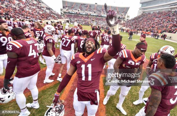 Defensive end Houshun Gaines of the Virginia Tech Hokies sings the fight song following the game against the Pittsburgh Panthers at Lane Stadium on...