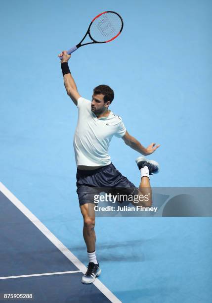 Grigor Dimitrov of Bulgaria plays a backhand in his match against Jack Sock of USA in the semi finals during day seven of the Nitto ATP World Tour...