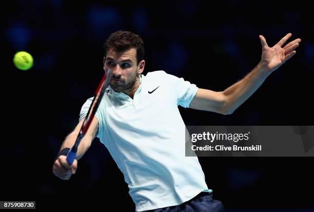 Grigor Dimitrov of Bulgaria plays a backhand in his semi final match against Jack Sock of the United States the Nitto ATP World Tour Finals at O2...