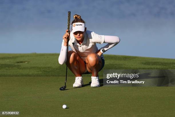 Nelly Korda of the United States lines up a putt on the 18th green during round three of the CME Group Tour Championship at the Tiburon Golf Club on...