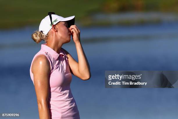Madelene Sagstrom of Sweden reacts after missing a putt on the 18th green during round three of the CME Group Tour Championship at the Tiburon Golf...
