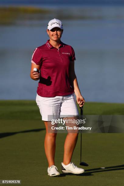 Caroline Masson of Germany reacts after putting on the 18th green during round three of the CME Group Tour Championship at the Tiburon Golf Club on...