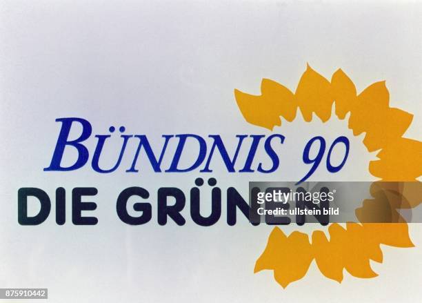 Das Logo der Partei Bündnis 90/Die Grünen. Eine stilisierte gelbe Blüte einer Sonnenblume umgibt den blau-schwarzen Schriftzug. Aufgenommen September...
