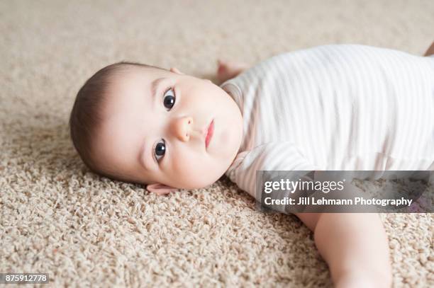 Baby On Rug Baby Laying On Carpet Photos and Premium High Res Pictures - Getty Images
