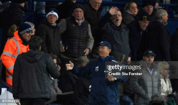 Manager Tony Pulis congratulates Antonio Conte as the fans react after the Premier League match between West Bromwich Albion and Chelsea at The...