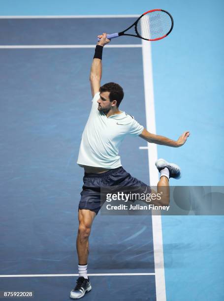 Grigor Dimitrov of Bulgaria plays a backhand in his Singles Semi Final match against Jack Sock of the United States during day seven of the Nitto ATP...