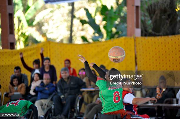 Players of Nepalese Wheelchair Basketball Team Woman and Bangladesh Wheelchair Basketball Team Woman fights for the ball in Final Game of...