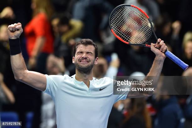 Bulgaria's Grigor Dimitrov celebrates his three set victory over US player Jack Sock in their men's singles semi-final match on day seven of the ATP...