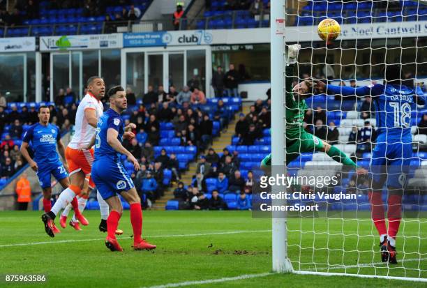 Peterborough United's Leo Da Silva Lopes heads an attempt at goal by Blackpool's Kyle Vassell off the goal-line during the Sky Bet League One match...