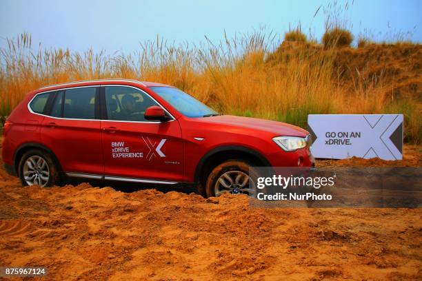 Drivers moves BMW X series cars on off track roads during the BMW xDrive Experience Tour 2017 in Jaipur, Rajasthan, India on 18 Nov, 2017.BMW...