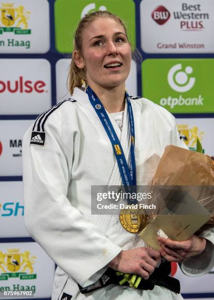 Former Junior World Champion and three times European champion, Kim Polling of the Netherlands sings along to the Dutch National Anthem after...