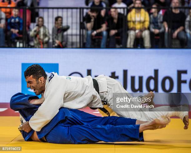 Saeid Mollaei of Iran counters world number one, Frank De Wit of the Netherlands for an ippon to win the u81kg bronze medal during the The Hague Judo...