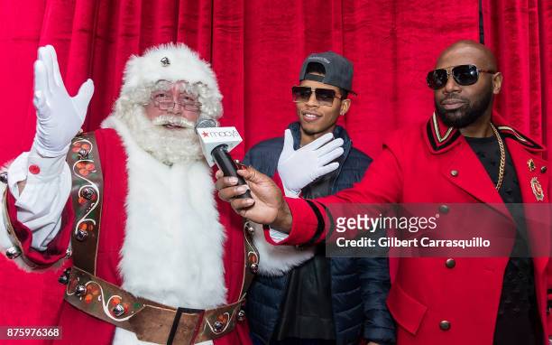 Santa Claus, actor Bryshere Y. Gray and comedian Buckwild attend Macy's Center City Celebrates Its Annual Holiday Window Unveiling And Family Fun Day...