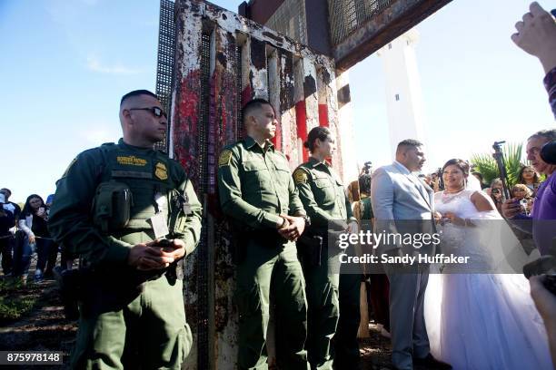 Brian Houston, who lives in San Diego, shares a moment wiith his new bride Evelia Reyes, who lives in Mexico with her daughter Alexis, while Border...