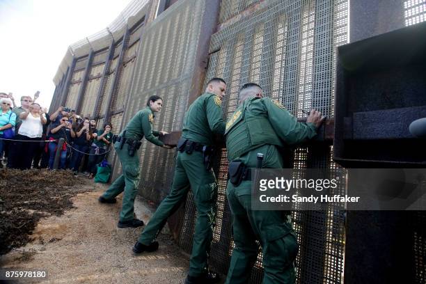 FBorder Patrol agents open a gate at the U.S. Mexico border November 18, 2017 in San Ysidro, California. The event, "Abriendo La Puerta De La...
