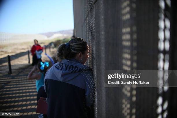 Family and griends speak to each other through the U.S. Mexico border November 18, 2017 in San Ysidro, California. The event, "Abriendo La Puerta De...