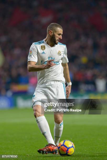 Karim Benzema of Real Madrid passes the ball during a match between Atletico Madrid and Real Madrid as part of La Liga at Wanda Metropolitano Stadium...