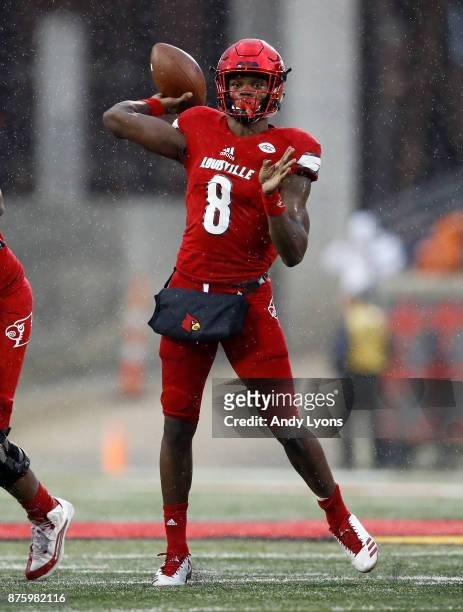 Lamar Jackson of the Louisville Cardinals throws a pass against the Syracuse Orange during the game at Papa John's Cardinal Stadium on November 18,...
