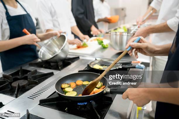 Cooking Staff Restaurant Kitchen Staff Photos and Premium High Res Pictures - Getty ...