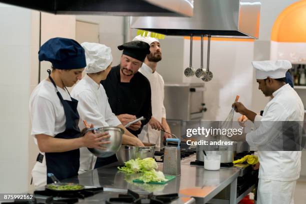 chef and sous chef making a list of things to purchase while everyone else is working - kitchen scale stock pictures, royalty-free photos & images